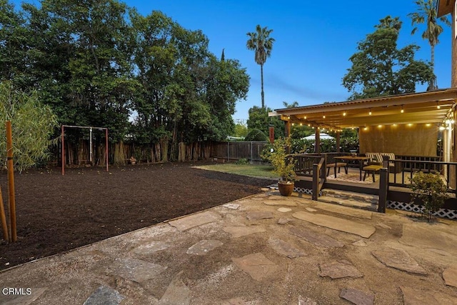 view of patio terrace at dusk