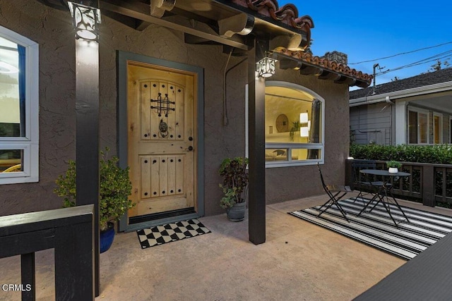 property entrance with a patio area