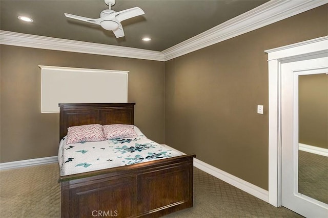 bedroom with ceiling fan, carpet, and crown molding