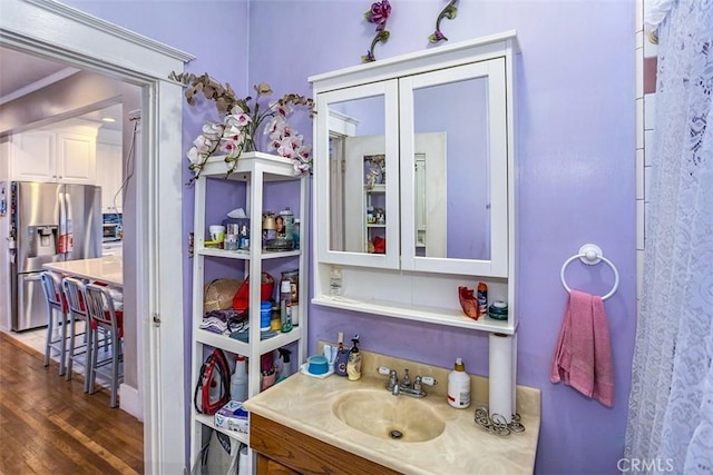 bathroom featuring vanity and hardwood / wood-style flooring