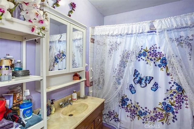 bathroom with vanity and curtained shower