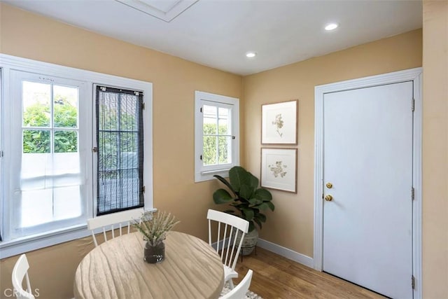 dining area with hardwood / wood-style flooring