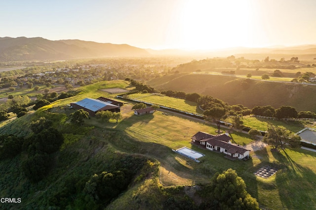 birds eye view of property with a rural view