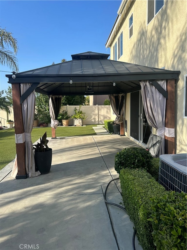 exterior space featuring a gazebo and central AC