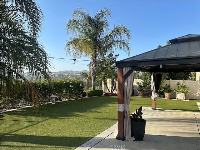 view of yard with a gazebo and a patio