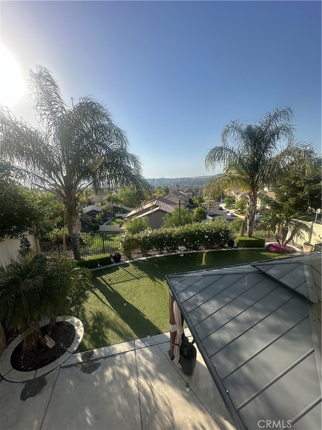 view of property's community with a lawn