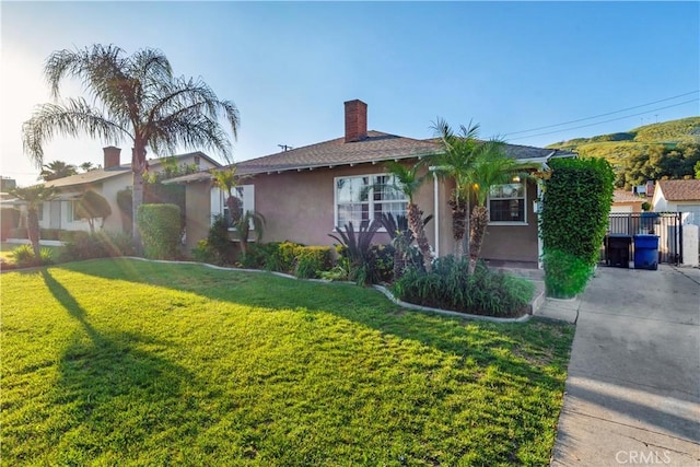 view of front of home with a front yard