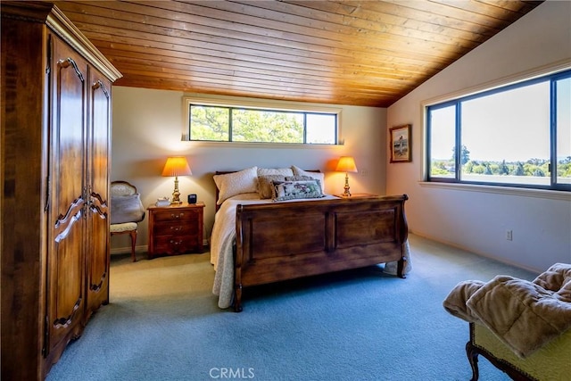 carpeted bedroom featuring vaulted ceiling and wooden ceiling