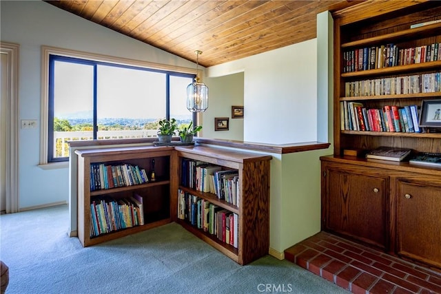 sitting room with carpet floors, wood ceiling, and vaulted ceiling