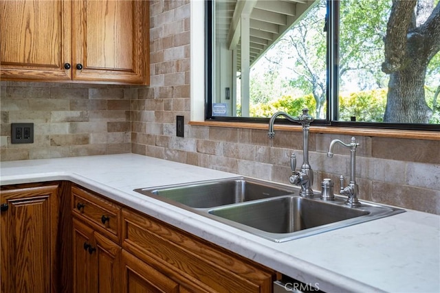 kitchen featuring decorative backsplash and sink