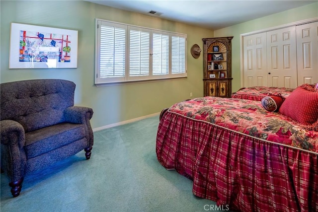 carpeted bedroom featuring a closet