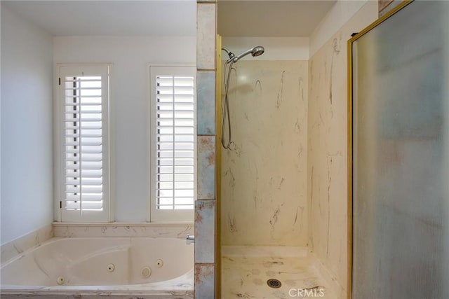 bathroom with separate shower and tub