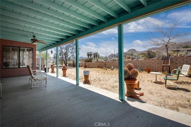 exterior space with ceiling fan