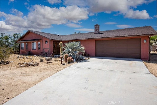 ranch-style house featuring a garage