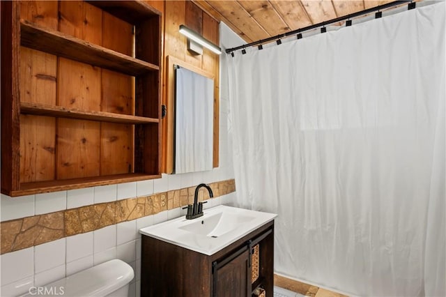 bathroom featuring toilet, wood ceiling, tile walls, vanity, and curtained shower