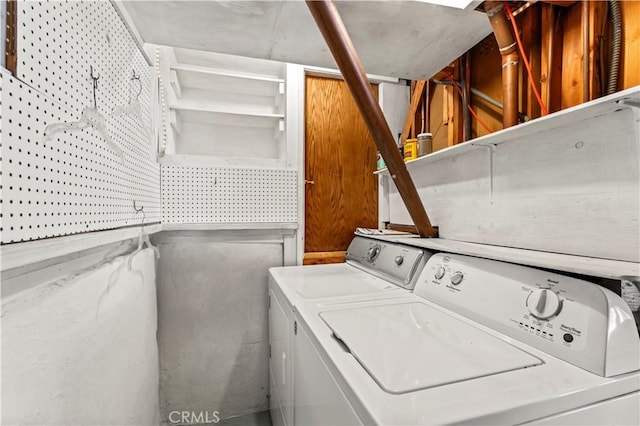 laundry room with separate washer and dryer