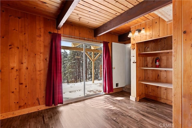 doorway to outside featuring hardwood / wood-style flooring, beamed ceiling, and wood walls