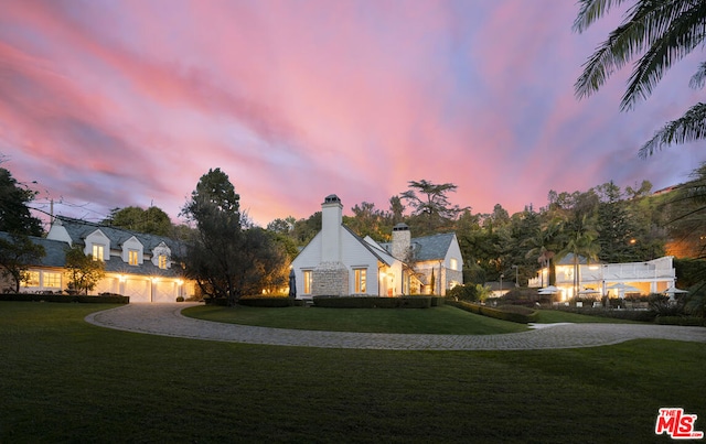 view of front of property with a yard