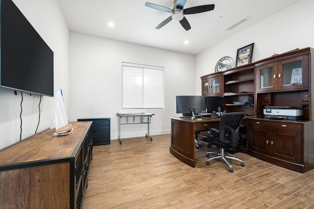 office featuring ceiling fan and light hardwood / wood-style floors