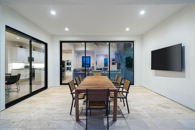 tiled dining room with ceiling fan