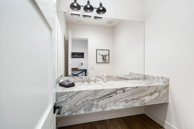 bathroom with sink and wood-type flooring