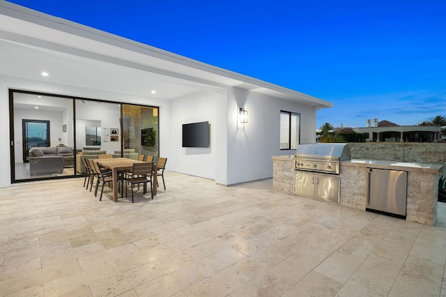 view of terrace featuring exterior kitchen and grilling area