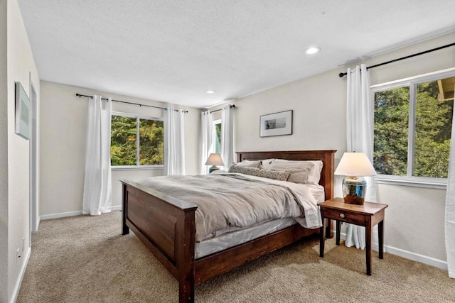 bedroom with light colored carpet