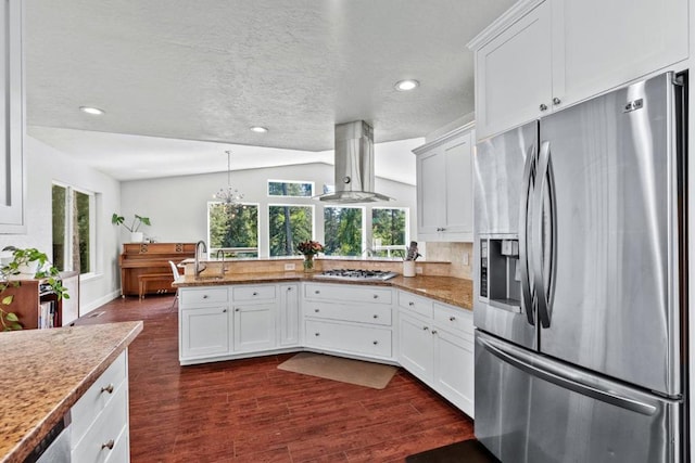 kitchen with white cabinets, stainless steel appliances, island exhaust hood, and dark wood-type flooring