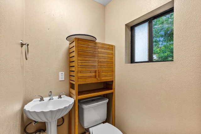 bathroom with toilet and sink