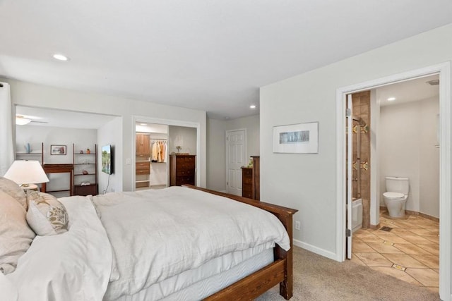 carpeted bedroom with ensuite bathroom