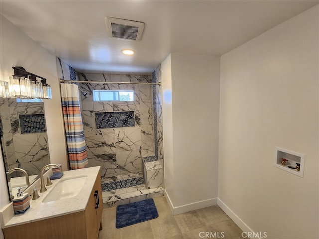 bathroom with curtained shower and vanity