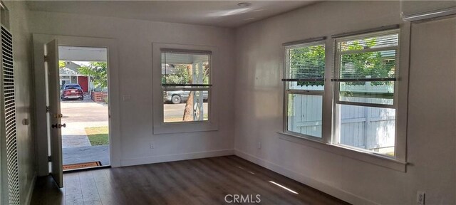 interior space with a healthy amount of sunlight and dark wood-type flooring