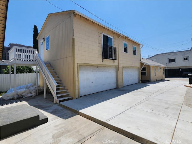 view of side of home with a garage