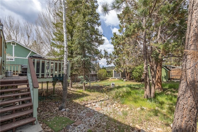 view of yard with a wooden deck