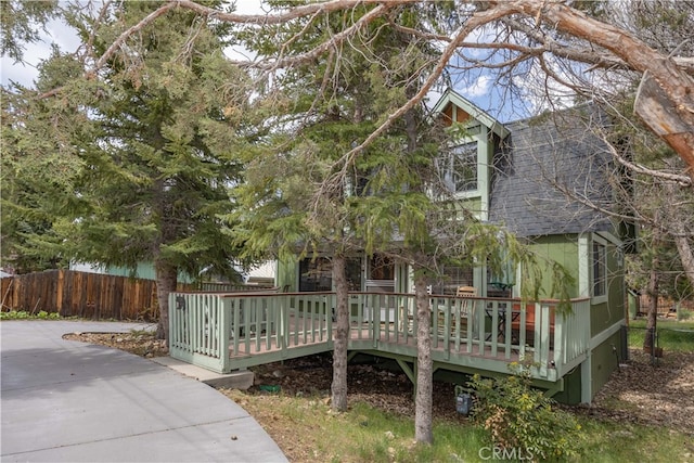 back of house with a wooden deck