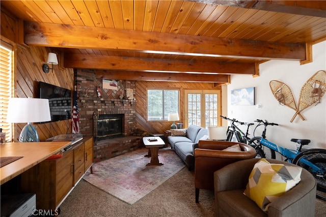 carpeted living room featuring wood ceiling, wood walls, beam ceiling, and a fireplace