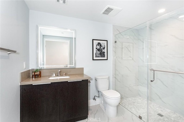 bathroom with vanity, an enclosed shower, and toilet