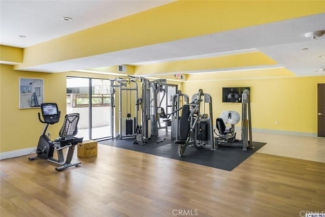 gym with hardwood / wood-style flooring