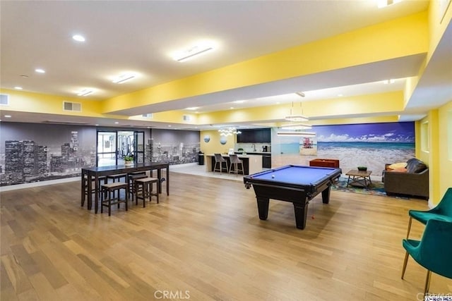 playroom with wood-type flooring, indoor bar, and billiards