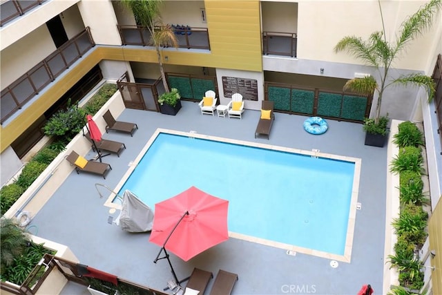 view of swimming pool with a patio