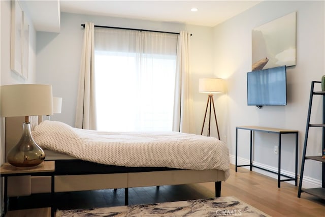 bedroom with light hardwood / wood-style floors