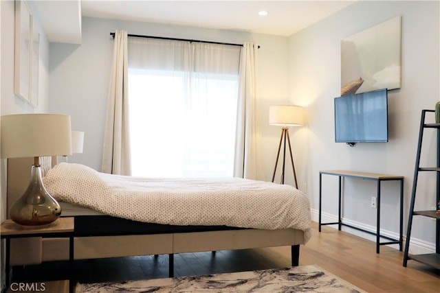 bedroom featuring light wood-type flooring