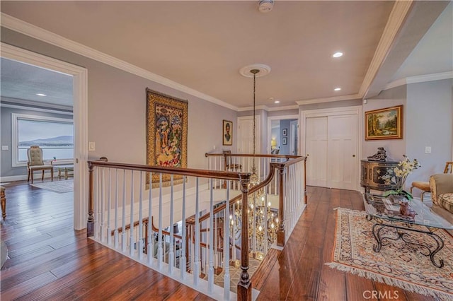 hallway featuring dark hardwood / wood-style floors and crown molding