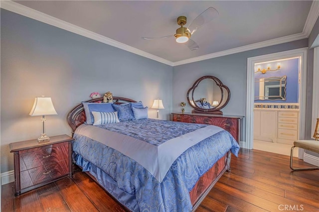 bedroom featuring ceiling fan, ensuite bathroom, dark wood-type flooring, and ornamental molding