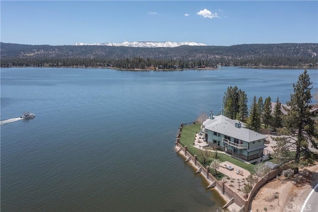 aerial view featuring a water and mountain view