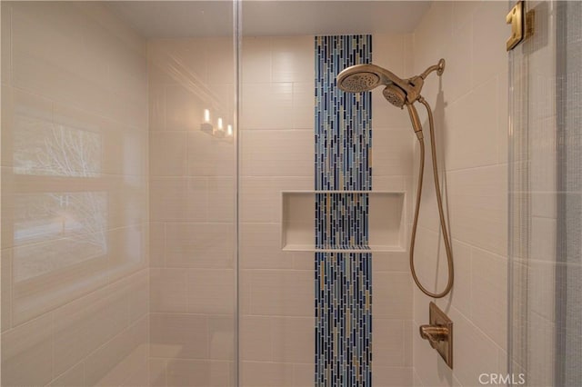 interior details featuring tiled shower