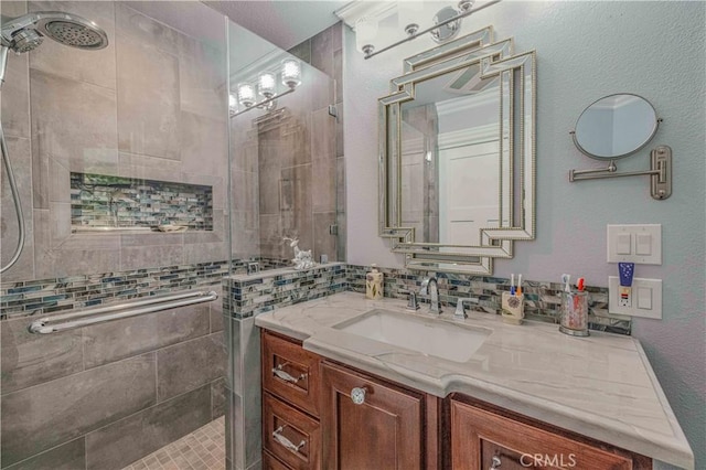 bathroom with vanity and a shower with door