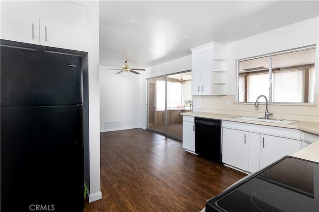 kitchen featuring ceiling fan, dark hardwood / wood-style floors, black appliances, sink, and white cabinets