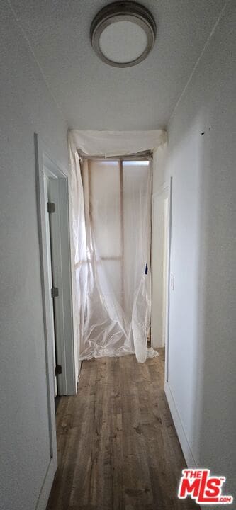 hall with dark hardwood / wood-style flooring