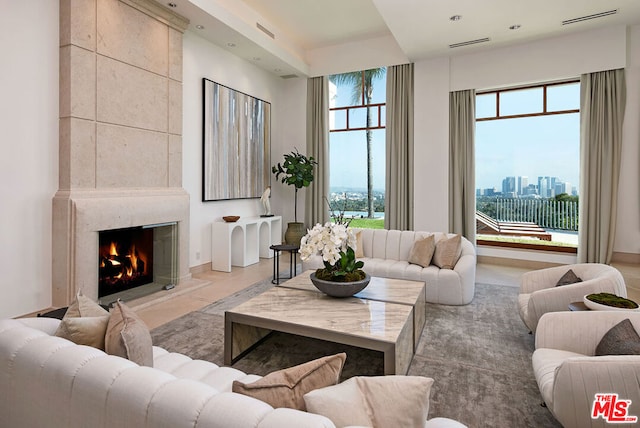 living room with a high end fireplace